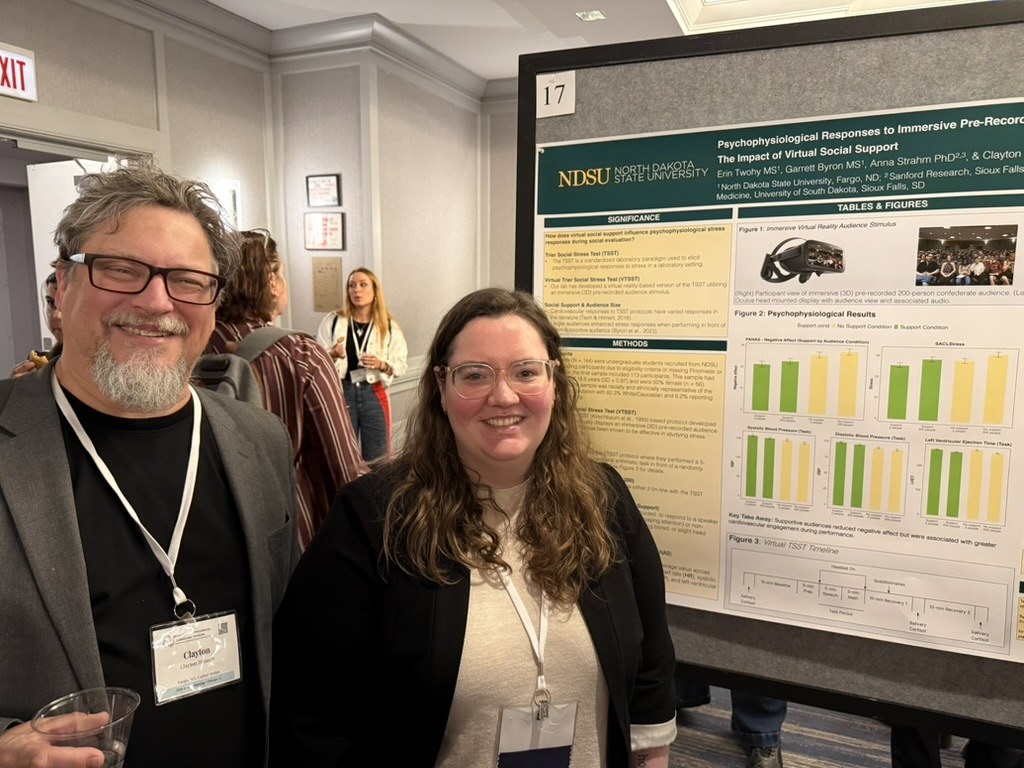 Clayton Hilmert and Erin Twohy beside Erin's citation poster at SBSM 2026