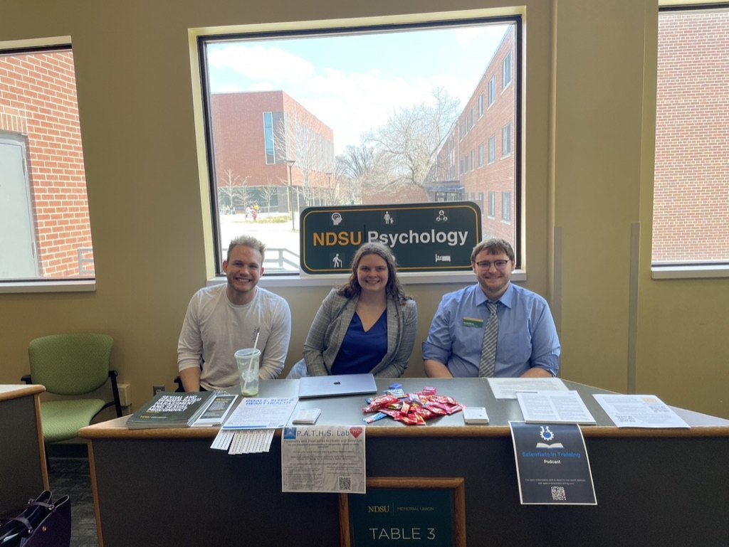 Volunteers at the NDSU Psychology stress and sleep outreach table in the Memorial Union